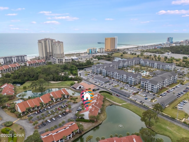 birds eye view of property featuring a city view and a water view
