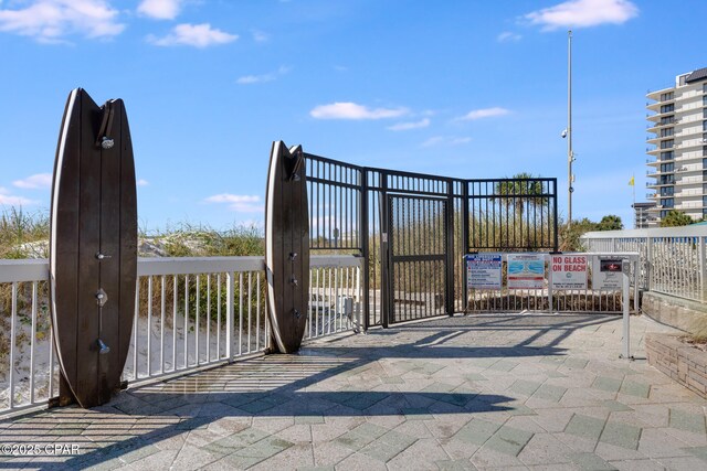 view of gate featuring fence