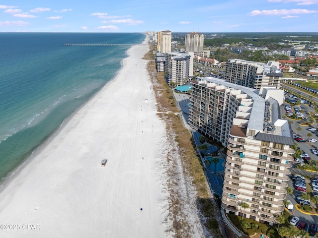 birds eye view of property with a water view, a city view, and a view of the beach