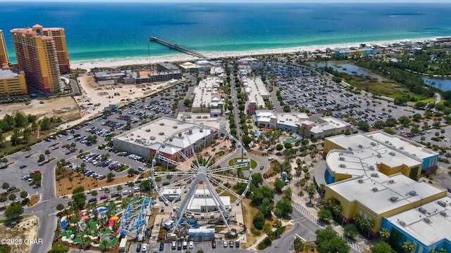 drone / aerial view featuring a view of the beach and a water view