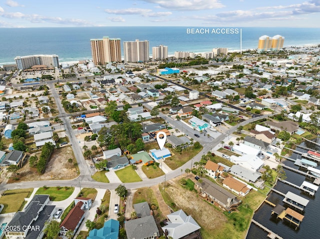 birds eye view of property with a city view and a water view