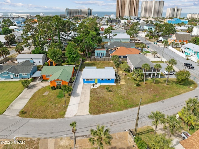 drone / aerial view featuring a residential view and a city view