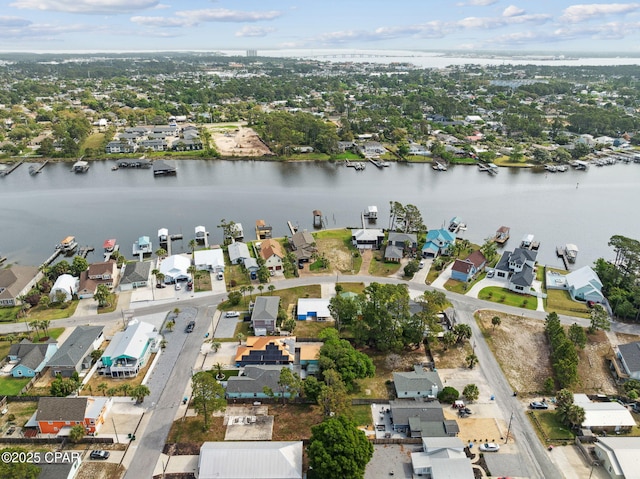 drone / aerial view featuring a water view and a residential view