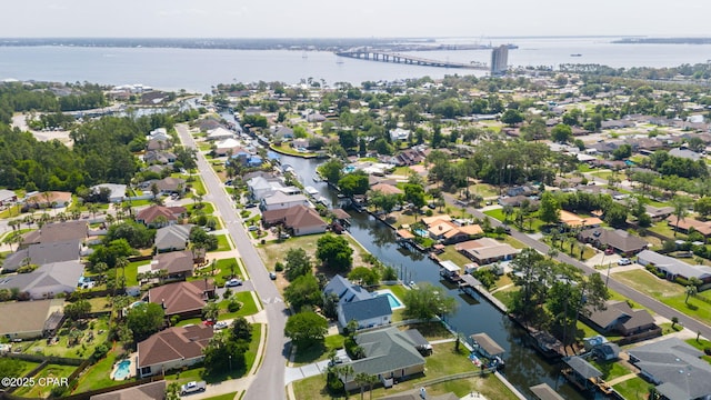 drone / aerial view featuring a water view and a residential view