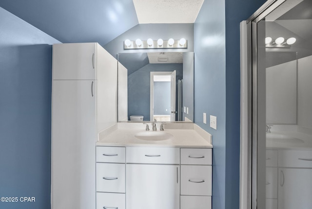 bathroom featuring vanity and a textured ceiling