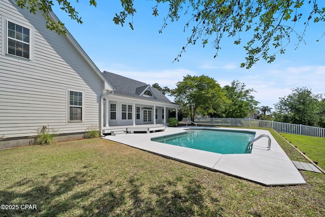 view of pool featuring a yard, a patio area, a fenced in pool, and a fenced backyard