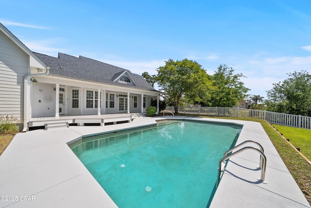 view of pool featuring a patio area, fence, a deck, and a fenced in pool