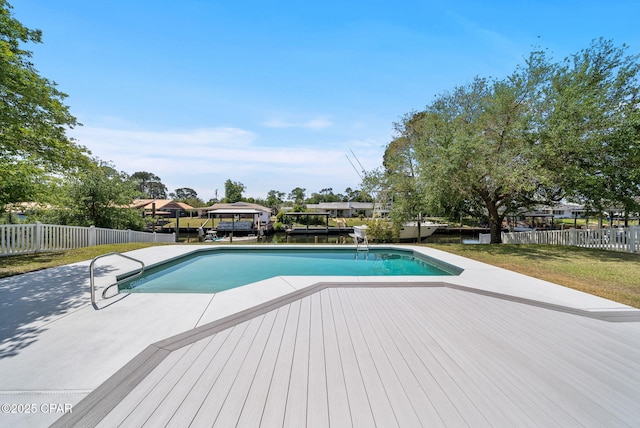 view of swimming pool with fence and a fenced in pool