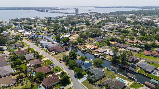 drone / aerial view with a water view and a residential view