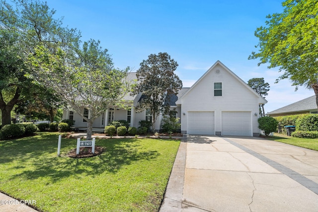 view of front of property with driveway, an attached garage, and a front yard