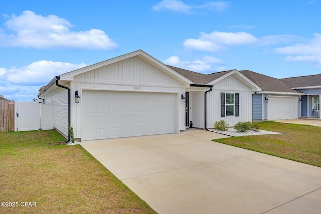 ranch-style home with a garage, a gate, driveway, and a front yard