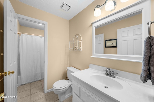 bathroom with vanity, toilet, visible vents, tile patterned flooring, and a shower with shower curtain