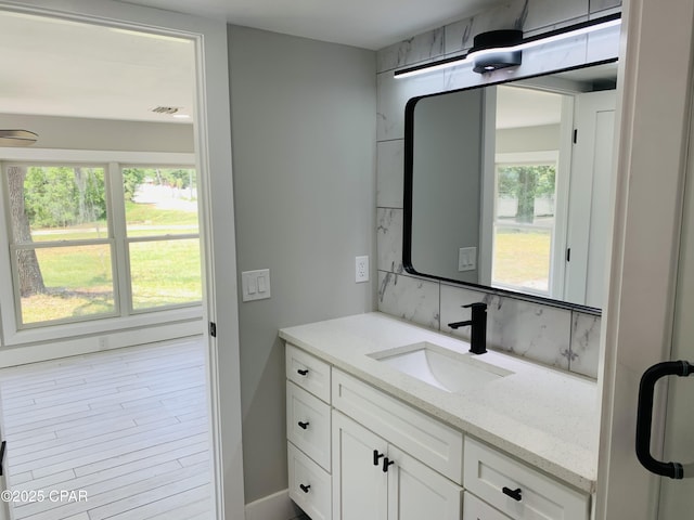 1003 E 8th St, Lynn Haven, FL 32444 - bathroom featuring baseboards and vanity