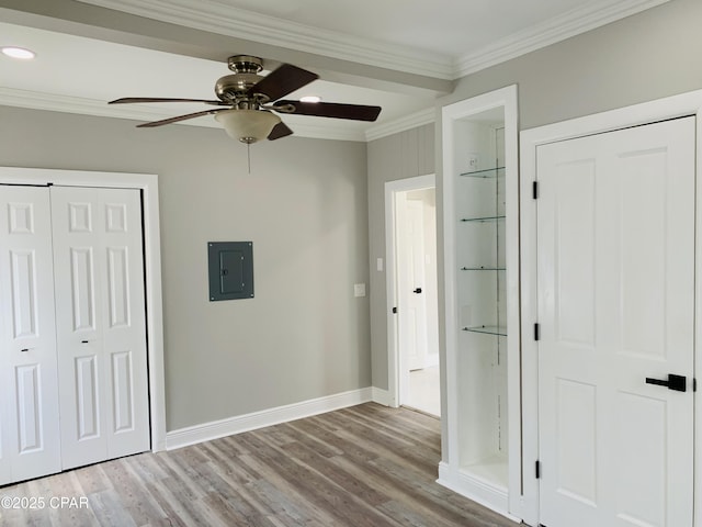 1003 E 8th St, Lynn Haven, FL 32444 - unfurnished bedroom featuring recessed lighting, wood finished floors, ornamental molding, electric panel, and baseboards