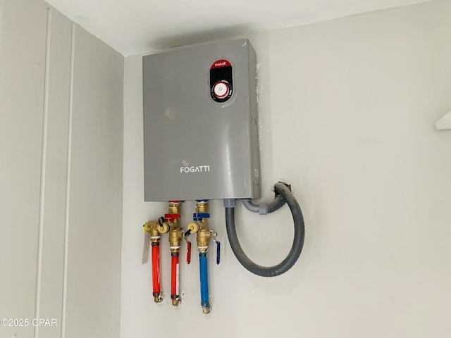 1003 E 8th St, Lynn Haven, FL 32444 - utility room featuring tankless water heater