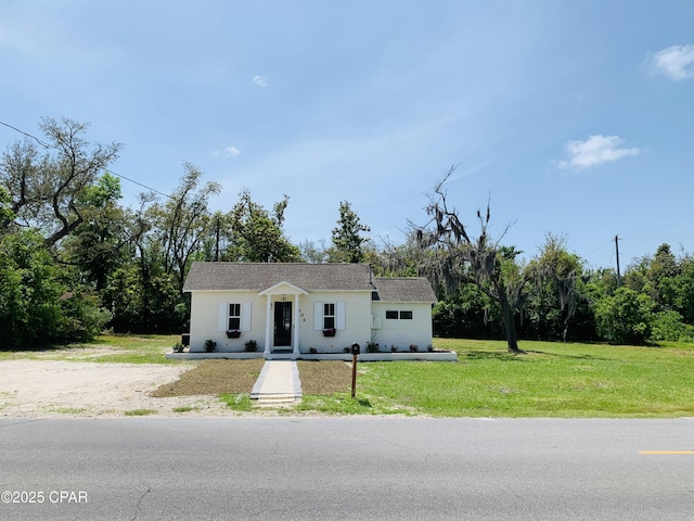 1003 E 8th St, Lynn Haven, FL 32444 - view of front of home featuring a front lawn