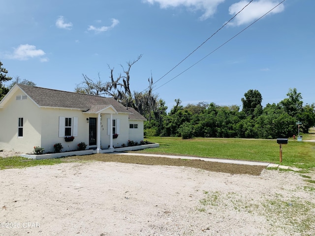 1003 E 8th St, Lynn Haven, FL 32444 - view of front of house featuring a front lawn and roof with shingles
