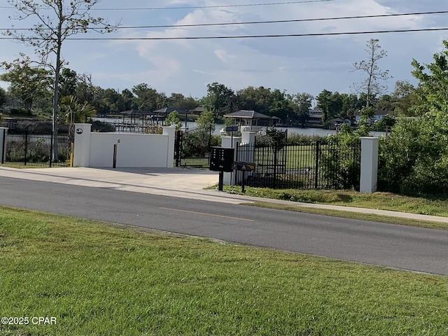 1003 E 8th St, Lynn Haven, FL 32444 - view of street with a gate and sidewalks