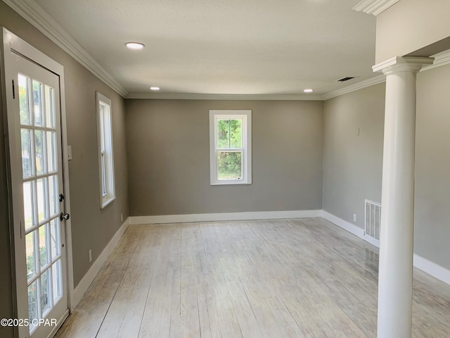 1003 E 8th St, Lynn Haven, FL 32444 - empty room featuring recessed lighting, ornate columns, light wood-style flooring, baseboards, and visible vents