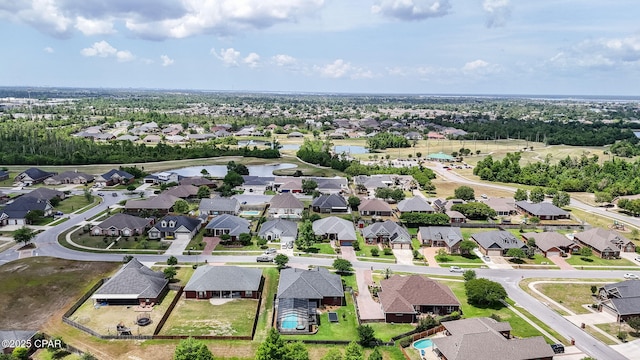 drone / aerial view featuring a water view and a residential view