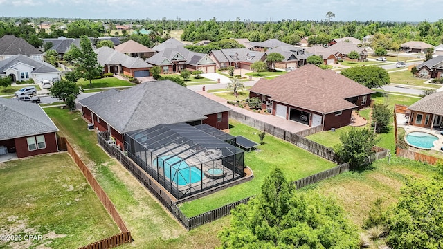 birds eye view of property with a residential view