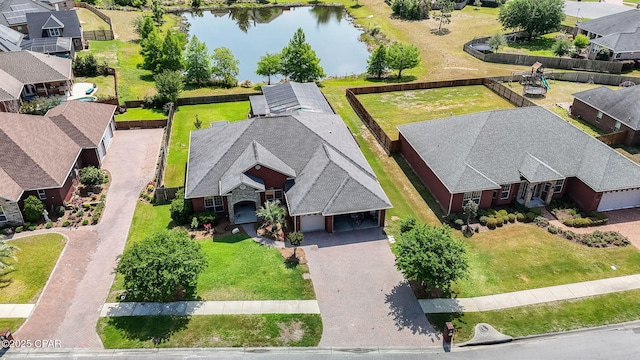 drone / aerial view with a residential view and a water view