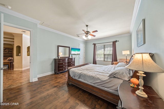 bedroom with crown molding, arched walkways, visible vents, and dark wood-style floors