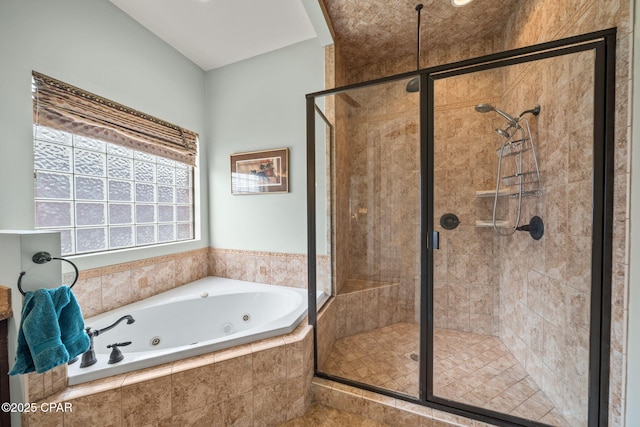 bathroom with a whirlpool tub and a stall shower