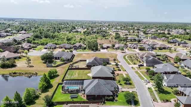 drone / aerial view featuring a water view and a residential view