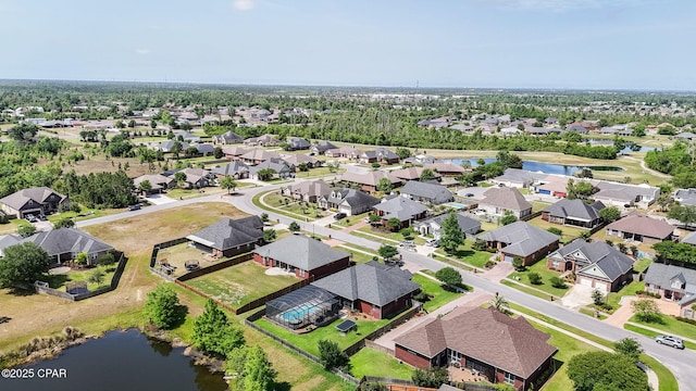drone / aerial view with a water view and a residential view