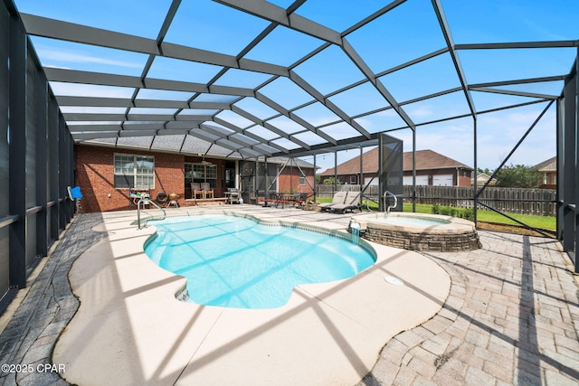 view of pool featuring a fenced backyard, a residential view, a patio area, a lanai, and a pool with connected hot tub