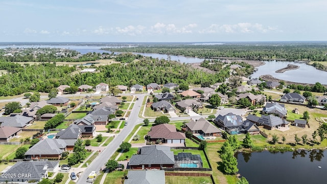 drone / aerial view featuring a water view and a residential view
