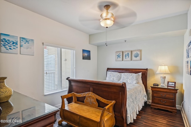 9900 S Thomas Dr Unit 1418, Panama City Beach, FL 32408 - bedroom featuring a ceiling fan, baseboards, and dark wood-type flooring
