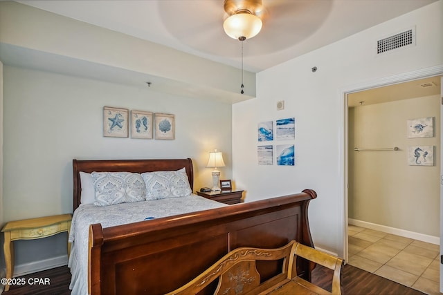 9900 S Thomas Dr Unit 1418, Panama City Beach, FL 32408 - tiled bedroom with visible vents, a ceiling fan, and baseboards