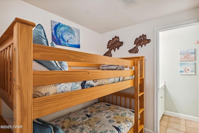 9900 S Thomas Dr Unit 1418, Panama City Beach, FL 32408 - bedroom with tile patterned flooring, visible vents, and baseboards