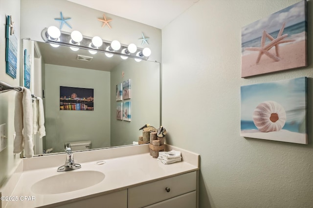 9900 S Thomas Dr Unit 1418, Panama City Beach, FL 32408 - half bathroom with toilet, visible vents, and vanity