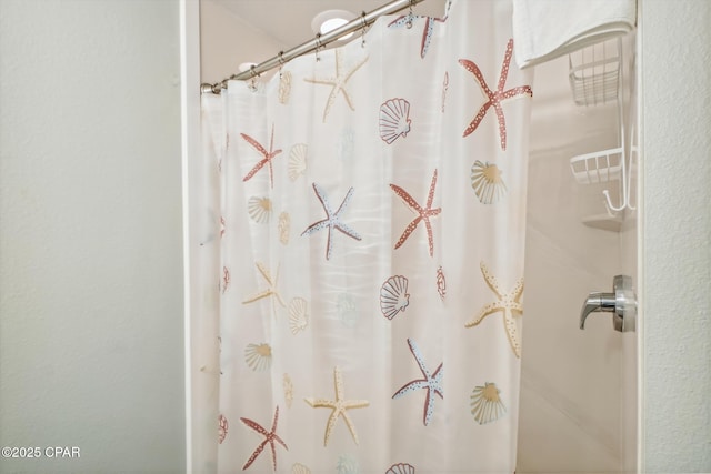 9900 S Thomas Dr Unit 1418, Panama City Beach, FL 32408 - bathroom featuring a shower with shower curtain