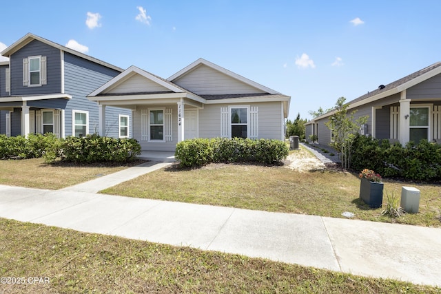 bungalow-style home featuring a front lawn