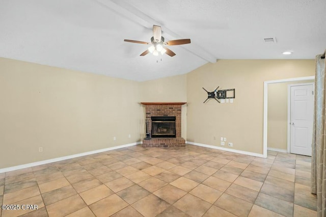 unfurnished living room with lofted ceiling with beams, a brick fireplace, light tile patterned floors, ceiling fan, and baseboards