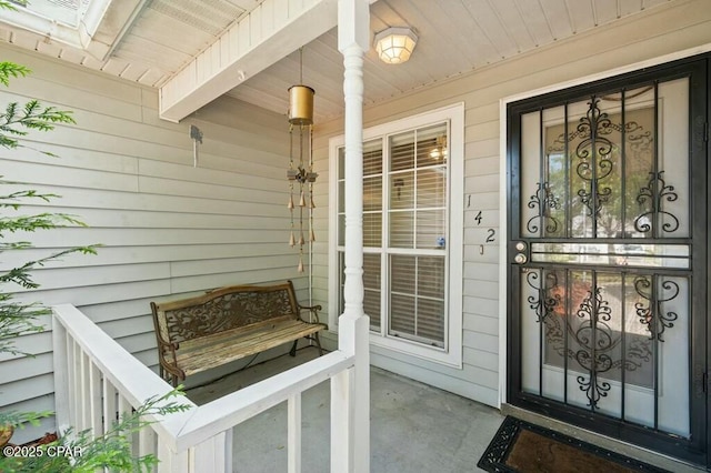 property entrance featuring covered porch