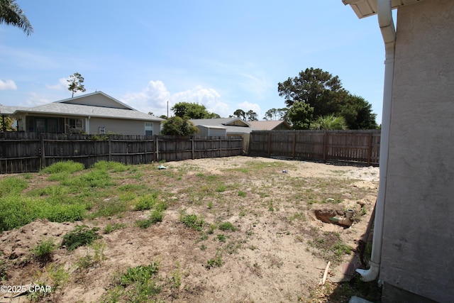 view of yard featuring a fenced backyard
