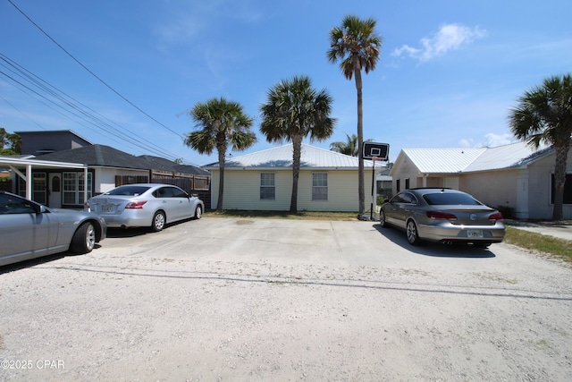 ranch-style house with uncovered parking