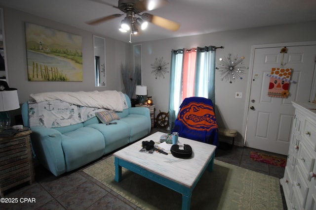 living area featuring tile patterned floors and ceiling fan