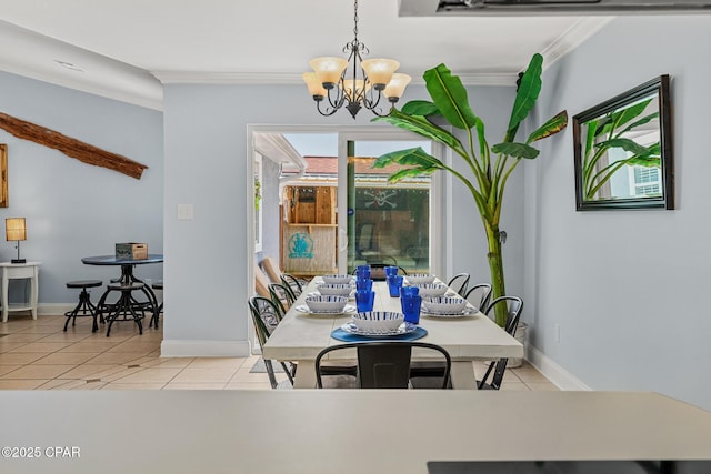dining space with a chandelier, light tile patterned floors, ornamental molding, and baseboards