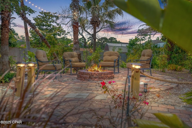 view of patio / terrace with a fire pit and a fenced backyard
