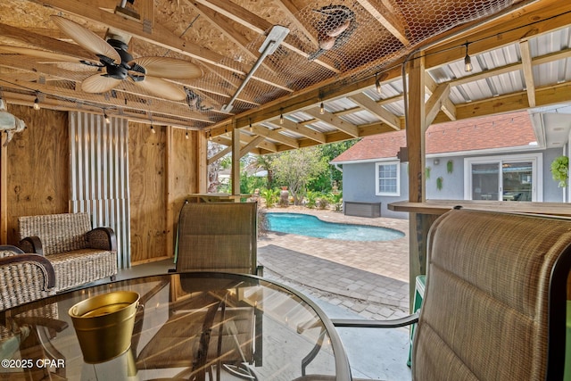 pool with ceiling fan and a patio area