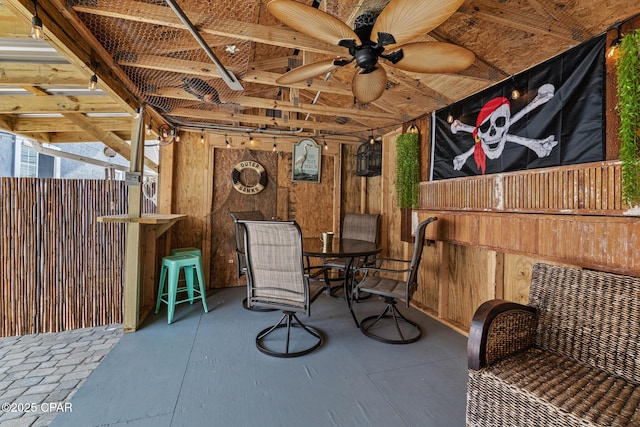 view of patio with outdoor dining area and ceiling fan