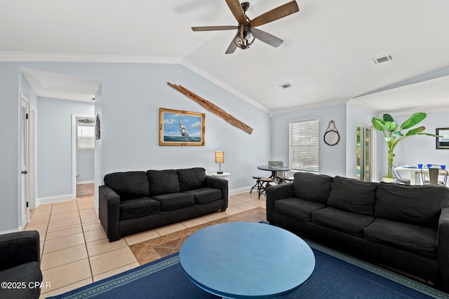 living room featuring ceiling fan, light tile patterned floors, visible vents, and a healthy amount of sunlight
