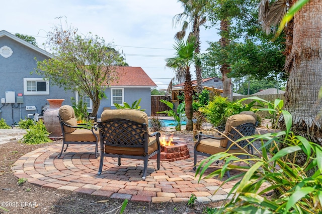 view of patio / terrace with a fenced backyard and an outdoor fire pit