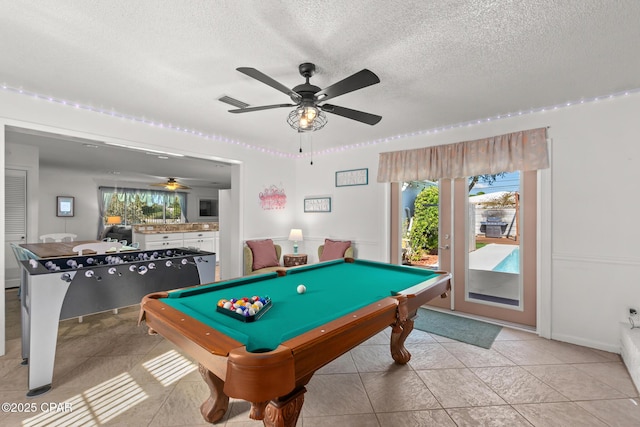 recreation room with visible vents, ceiling fan, a textured ceiling, pool table, and light tile patterned floors